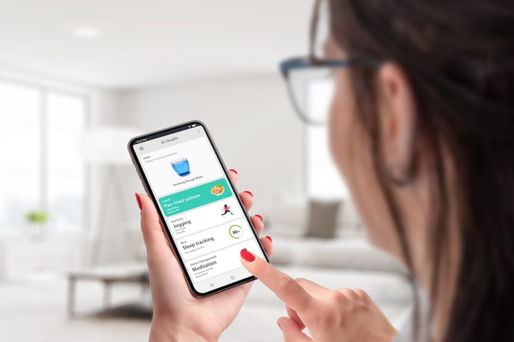 Girl holds a smartphone featuring the health app. Embracing the concept of artificial intelligence for health management, the app tracks her nutrition, exercise, and other health metrics